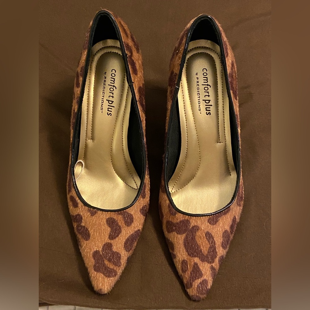 Leopard print calf hair pumps.